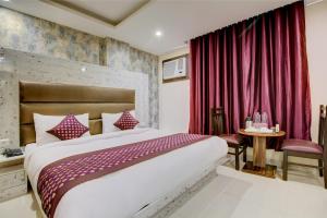 Letto o letti in una camera di Smart Plaza Hotel