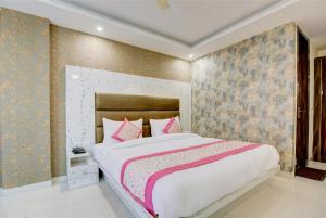 Letto o letti in una camera di Smart Plaza Hotel