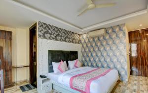 Letto o letti in una camera di Smart Plaza Hotel