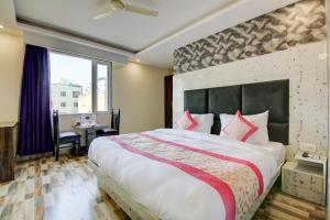 Letto o letti in una camera di Smart Plaza Hotel