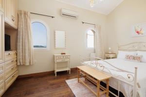 A bed or beds in a room at Villa Magnolia Corfu