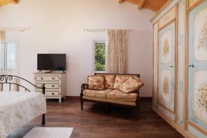 A television and/or entertainment centre at Villa Magnolia Corfu