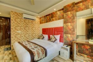 Letto o letti in una camera di Smart Plaza Hotel