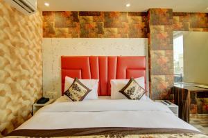 Letto o letti in una camera di Smart Plaza Hotel