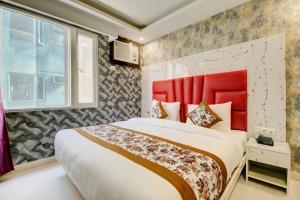Letto o letti in una camera di Smart Plaza Hotel