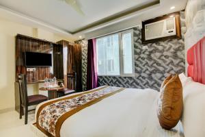 Letto o letti in una camera di Smart Plaza Hotel