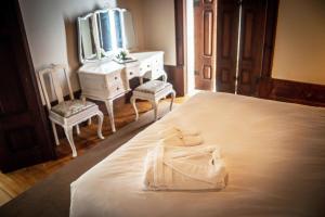 Uma cama ou camas num quarto em Casa com Historia