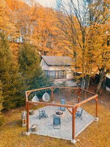 an aerial view of a patio with chairs and a fire pit at Teodor Chalet in Avrig