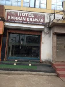 a hotel with a sign on the front of a building at Hotel Bishram Bhawan,Bhubaneswar in Bhubaneshwar