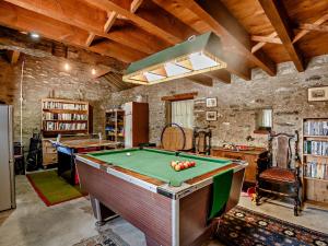 a billiard room with a pool table in it at 3 Bed in Conwy 50933 in Eglwys-Fâch