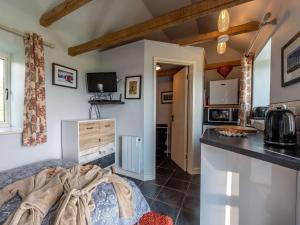 a room with a kitchen with a bed and a counter at 1 Bed in Knighton 51898 in Beguildy