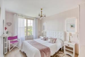 Katil atau katil-katil dalam bilik di VILLA MAISON BLANCHE TULLE 1 à 4 personnes