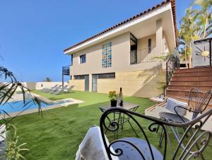 a view of a house with a yard at Miya del Sol Heated Saltwater Pool in La Orotava