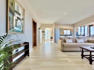 a living room with a couch and a table at Miya del Sol Heated Saltwater Pool in La Orotava