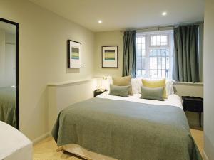 a bedroom with a large bed and a window at 3 Bed in Eastbourne 57383 in Alfriston