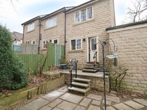 a brick house with stairs in front of it at 2 Bed in Alnwick CN101 in Alnwick