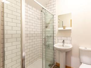 a bathroom with a sink and a glass shower at 4 bed in Priestcliffe 57687 in Millers Dale