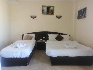 Postelja oz. postelje v sobi nastanitve Eiffel Hotel Hurghada