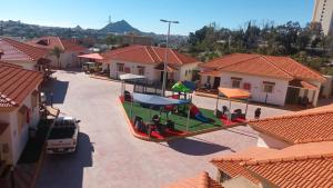 an aerial view of a toy train in a parking lot at شاليهات وفلل قاردن سيتي in Baljurashi