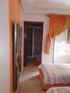 Voodi või voodid majutusasutuse RESIDENCE HAMZA Cosy appartement only family à Gueliz toas