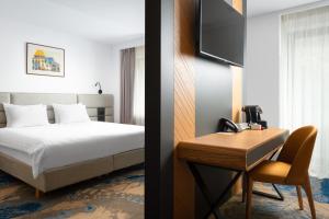 A bed or beds in a room at Alexandrion Experience