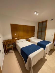Postel nebo postele na pokoji v ubytování Hotel Tio Pepe