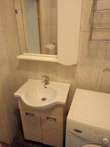 a bathroom with a sink and a toilet at Romana City Center Studio in Bucharest