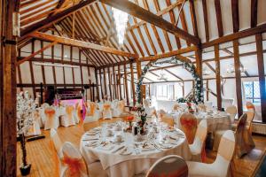 a large room with tables and chairs in it at Best Western Brome Grange Hotel in Brome