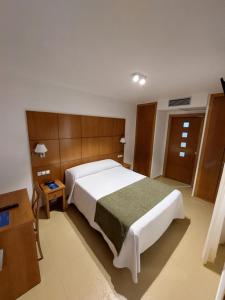 Postel nebo postele na pokoji v ubytování Hotel Tio Pepe