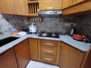 a kitchen with a stove and a counter top at 3B in Dehiwala