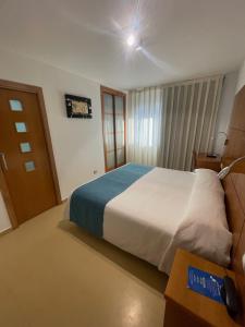 Postel nebo postele na pokoji v ubytování Hotel Tio Pepe