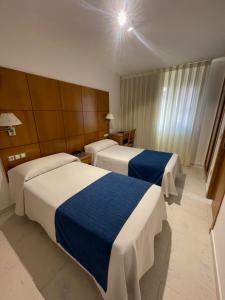 Postel nebo postele na pokoji v ubytování Hotel Tio Pepe