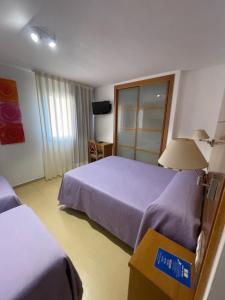 Postel nebo postele na pokoji v ubytování Hotel Tio Pepe