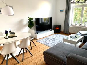 Χώρος καθιστικού στο DEUTSCHE VILLA - SUPERIOR APARTMENT- 1 Obergeschoss mit gem Sauna und Garten