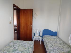 Un pat sau paturi într-o cameră la Miramare - 2 bedroom apartment