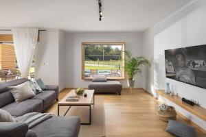 a living room with a couch and a table at Villa Analucija 2 by IstriaLux in Kršan