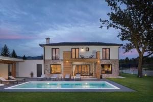 a house with a swimming pool in the yard at Villa Analucija 2 by IstriaLux in Kršan