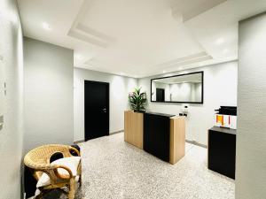 a waiting room with a chair and a mirror at Les Suites Bari Italian Excellence Bed and Breakfast in Bari