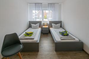 Postel nebo postele na pokoji v ubytování Ferienhaus Heimatdock