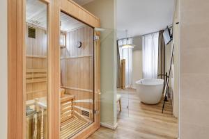 a bathroom with a tub and a walk in shower at WelcHome - Suites - in Perugia