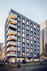 a tall building with people walking in front of it at Westminster Luxury Liverpool Apartment with Free Parking in Liverpool
