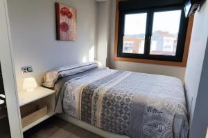 Ένα ή περισσότερα κρεβάτια σε δωμάτιο στο Joaquin Lóriga diseño centro Vigo