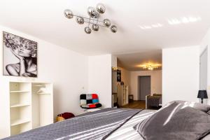 a bedroom with a bed and a living room at House of Lara in Brussels +7 photos