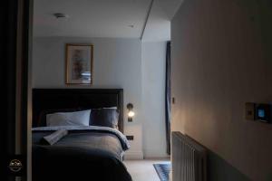 a bedroom with a bed in a room at Lovely 3-Bed Apartment in Altrincham in Altrincham
