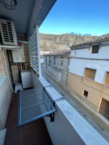 a bench on the balcony of a building at Apartamento Rural Mai Bardenas in Arguedas