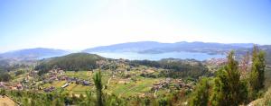 a view of a town on a hill with a lake at O Refuxio de la Jerezana in Redondela