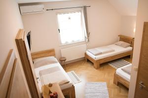 a room with two bunk beds and a window at Bed & Breakfast Dvorec in Petrovče +107 photos