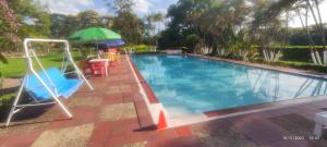 Bazén v ubytování Finca Turistica Rural El Descanso, privada Restrepo, Meta - Colombia nebo v jeho okolí