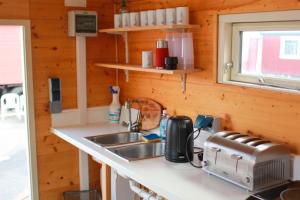 a kitchen with a sink and a counter top at Circus Fantasia in Rostock