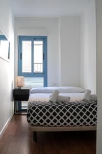 A bed or beds in a room at Apartamento Cerca de la playa